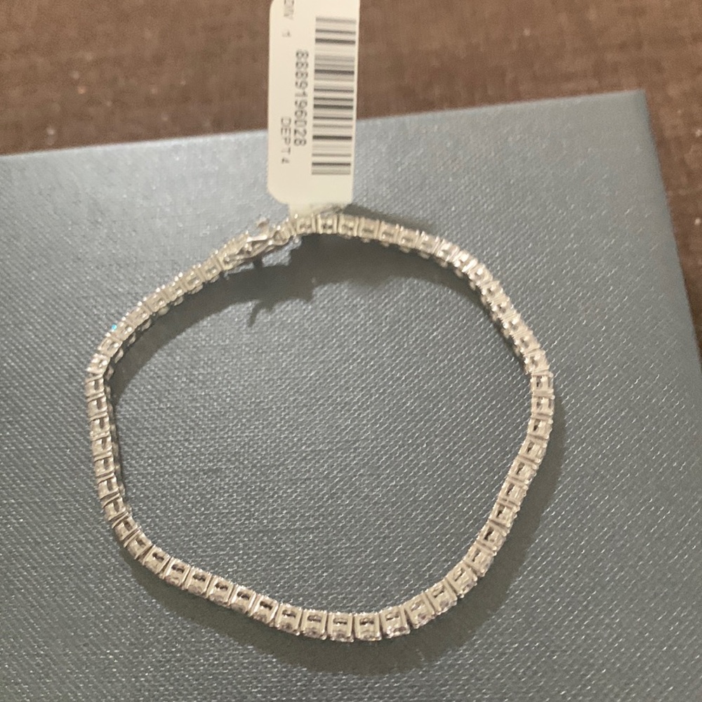Sterling silver cubic zirconia tennis bracelet with 54 round stones. Sparking.